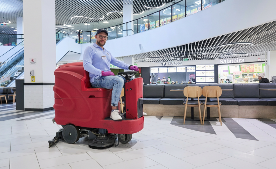 Professional cleaning in shopping centers: CPG high-tech floor scrubber machine maintaining a luxury mall atrium.